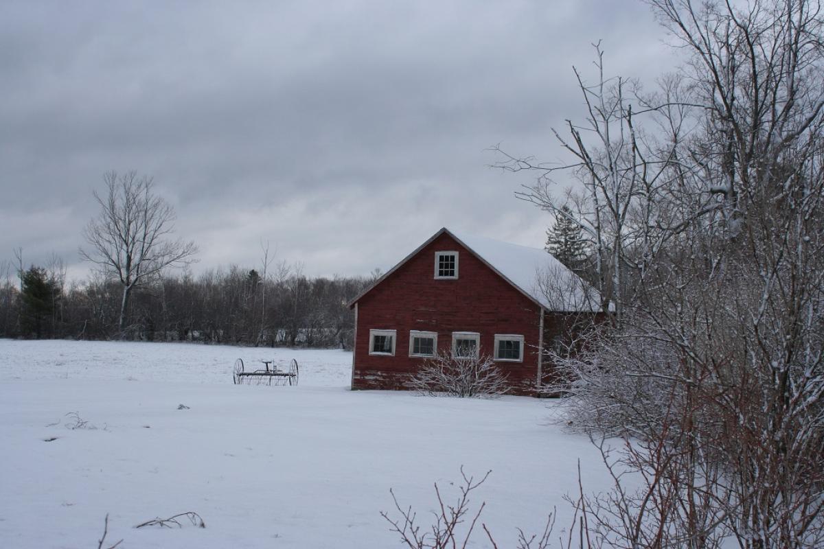 Winter scene with Barn in a snowy field s on Route 57  in Sandisfield