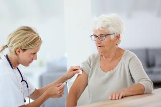 nurse giving vaccine 